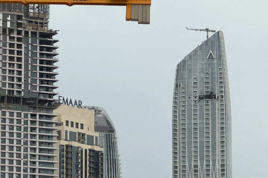 A damaged building in the vicinity of Dubai Creek Harbour after a drone fell on it, amid the U.S.-Israeli conflict with Iran, in Dubai, United Arab Emirates, March 12, 2026. Picture taken with a mobile phone. REUTERS/Stringer