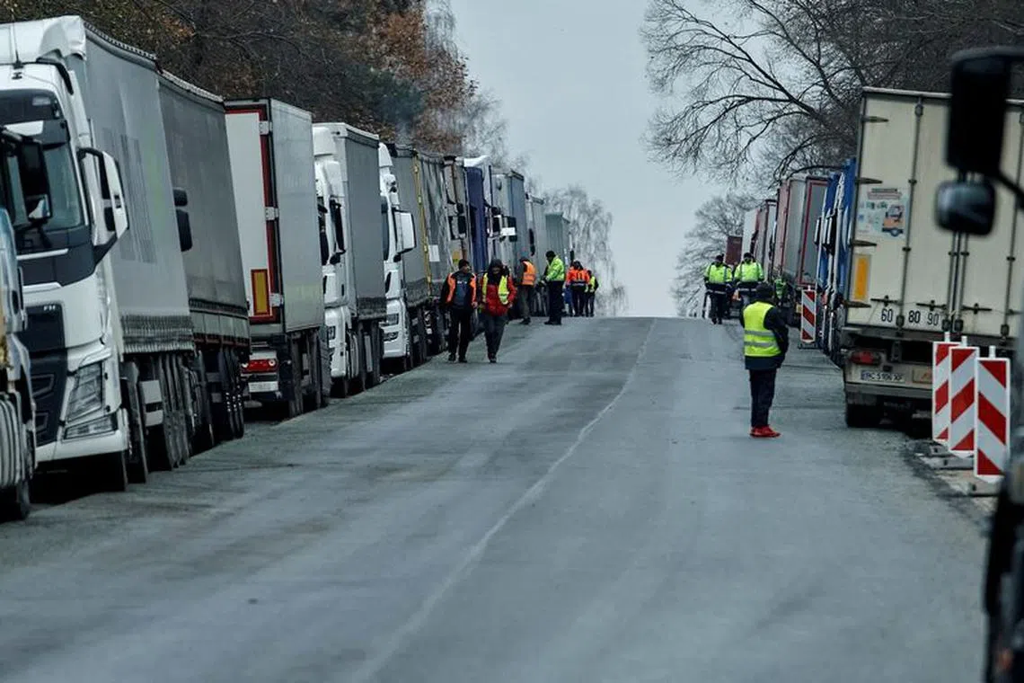 FILE PHOTO: Ukrainian trucks are parked near the Poland-Ukraine border, near the village of Korczowa, Poland November 19, 2023. REUTERS/Yan Dobronosov/File Photo