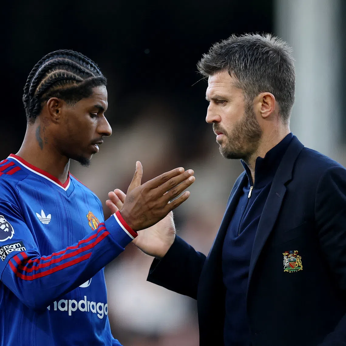 Soccer Football - Premier League - Fulham v Manchester United - Craven Cottage, London, Britain - September 20, 2026 Manchester United's Marcus Rashford and manager Michael Carrick after the match REUTERS/Toby Melville