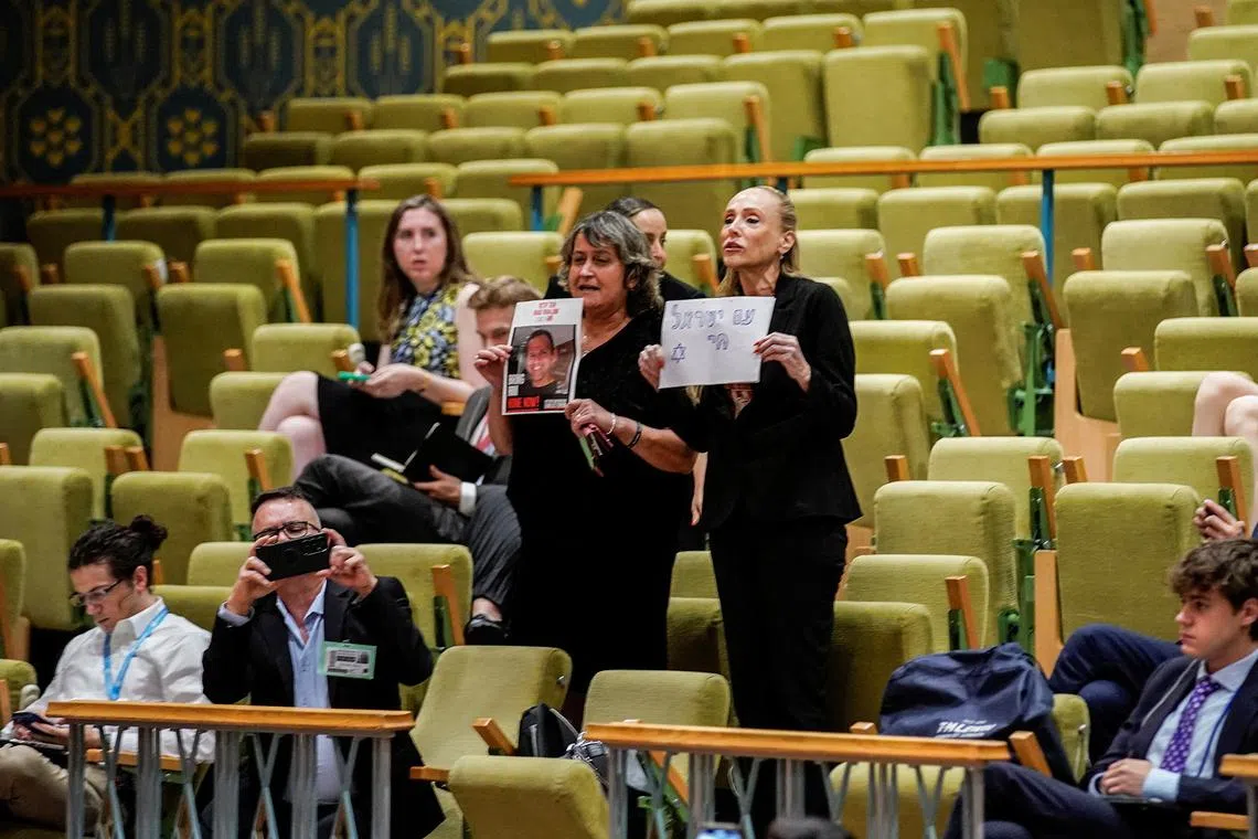 People protest for the release of the Israeli citizens kidnapped by Hamas during a meeting of the United Nations Security Council at the United Nations Headquarters, in New York City, U.S., July 17, 2024. REUTERS/Eduardo Munoz