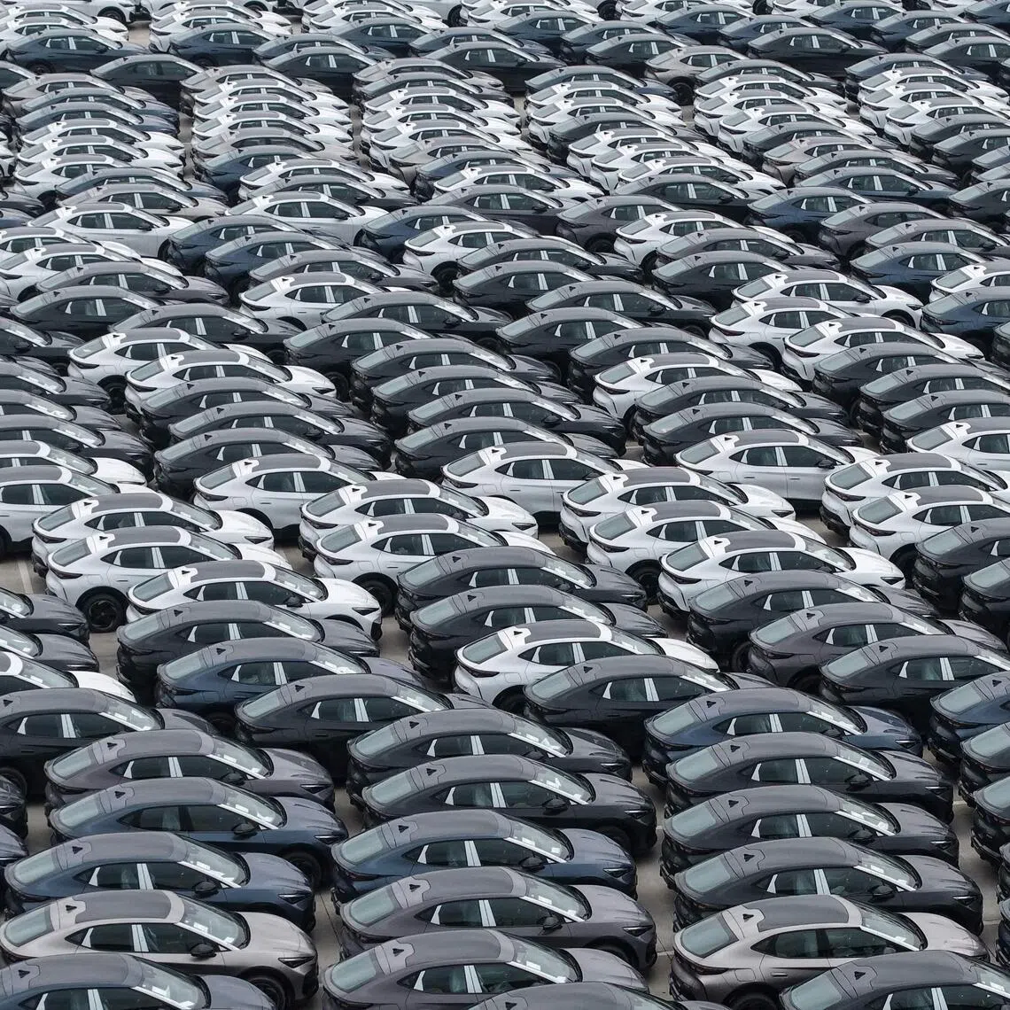 Chinese-made EV cars awaiting export are seen parked at the International Automobile Trade Port in Hangzhou in China's eastern Zhejiang province. 