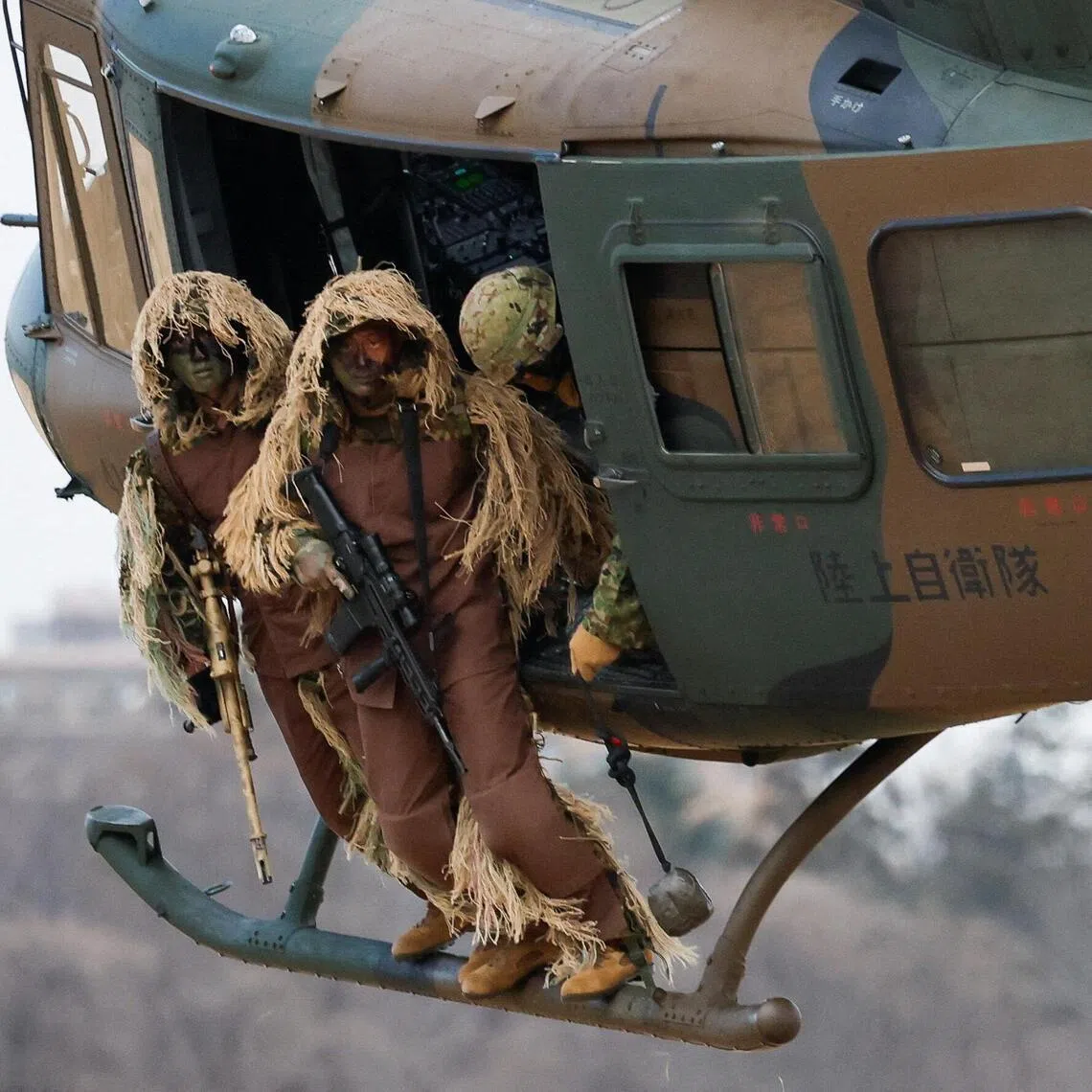 The Japanese Ground Self-Defense Force 1st Airborne Brigade take part in an annual New Year military drill in Funabashi, east of Tokyo.