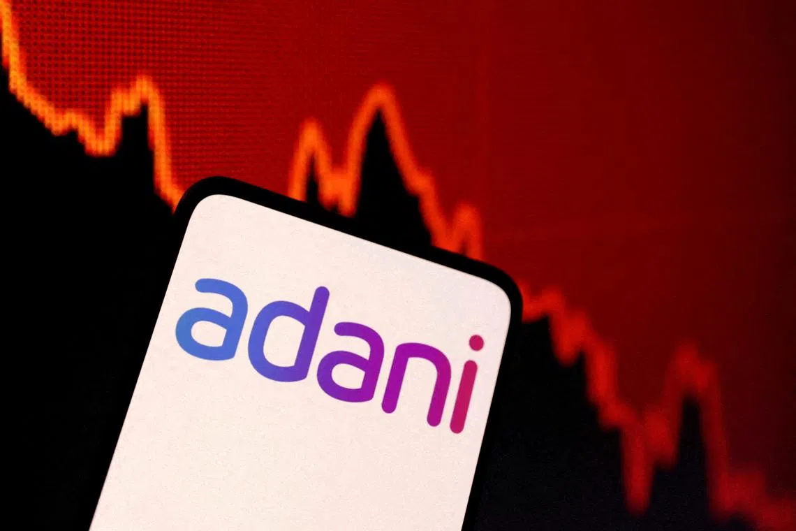 Adani Group stocks slumped on renewed concerns over the conglomerate’s ability to repay its debt.