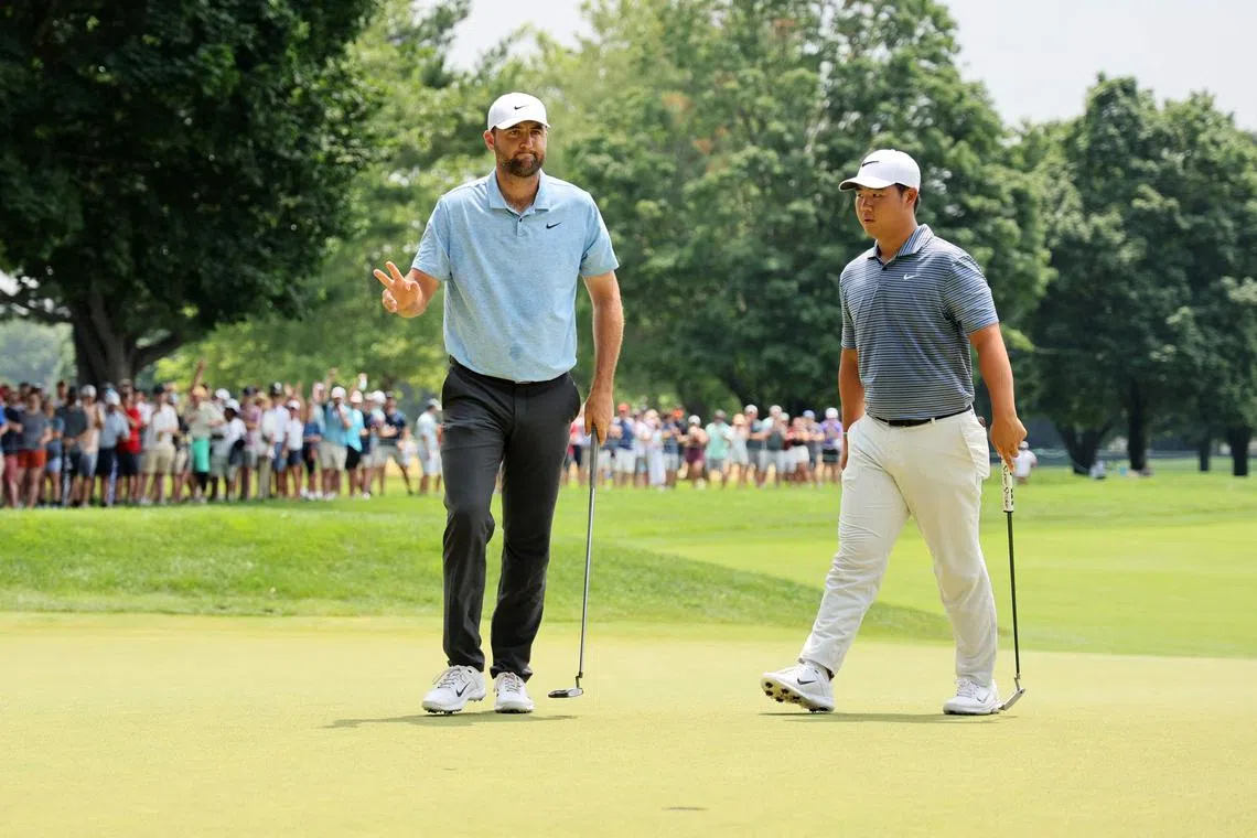 Scottie Scheffler and Tom Kim during the final round of the Travelers Championship in June.