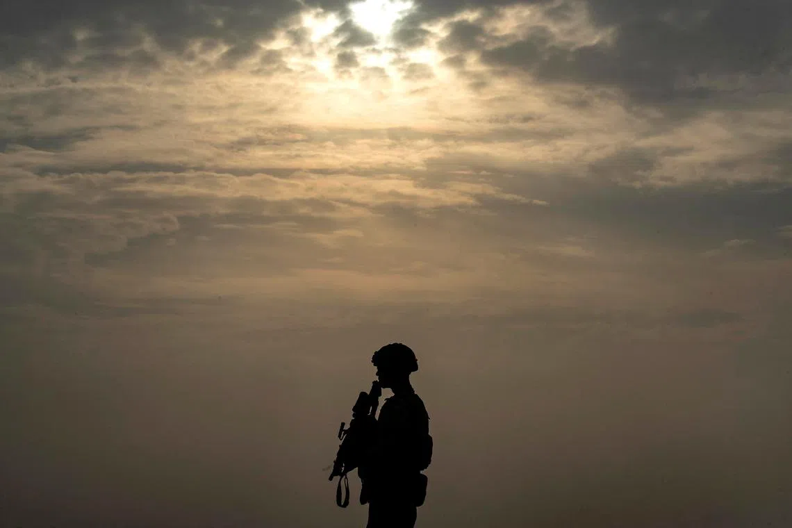 US forces patrol in the vicinity of the Hori rehabilitation centre for children of suspected Islamic State (IS) group, in the town of Tel Maaruf in Syria's northeastern Hasakeh province, on December 15, 2022. 