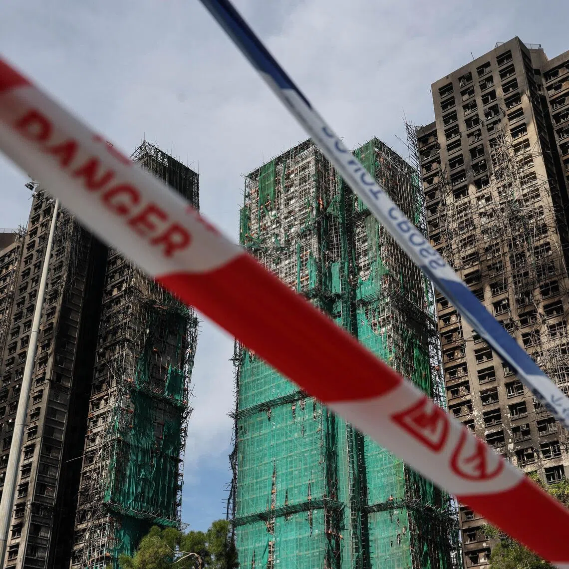 Police cordons are placed at the scene of the Wang Fuk Court housing estate fire in Tai Po, Hong Kong, on Nov 28.