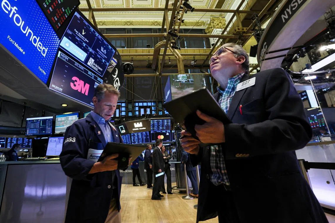 Traders work on the floor of the New York Stock Exchange.