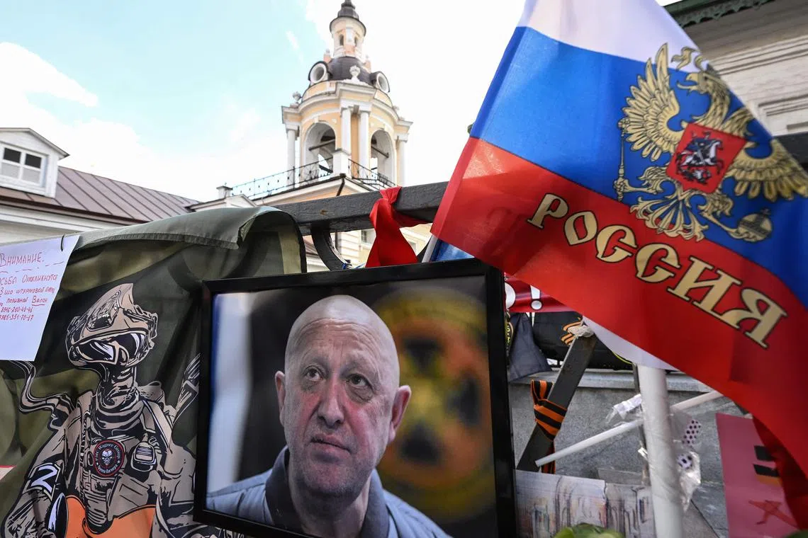 A portrait of late head of Wagner paramilitary group, Yevgeny Prigozhin displayed at a makeshift memorial in Moscow, on Aug 27.