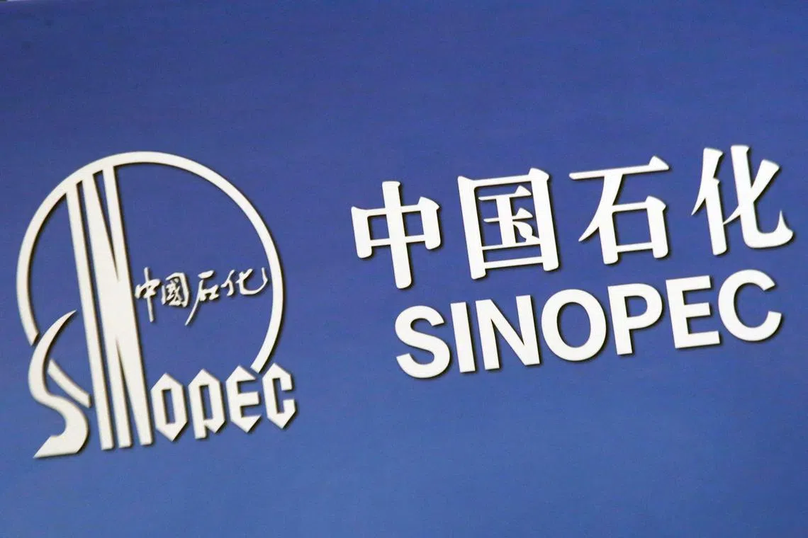 FILE PHOTO: The company logo of China’s Sinopec Corp displayed at a news conference in Hong Kong, March 26, 2018. REUTERS/Bobby Yip/File Photo