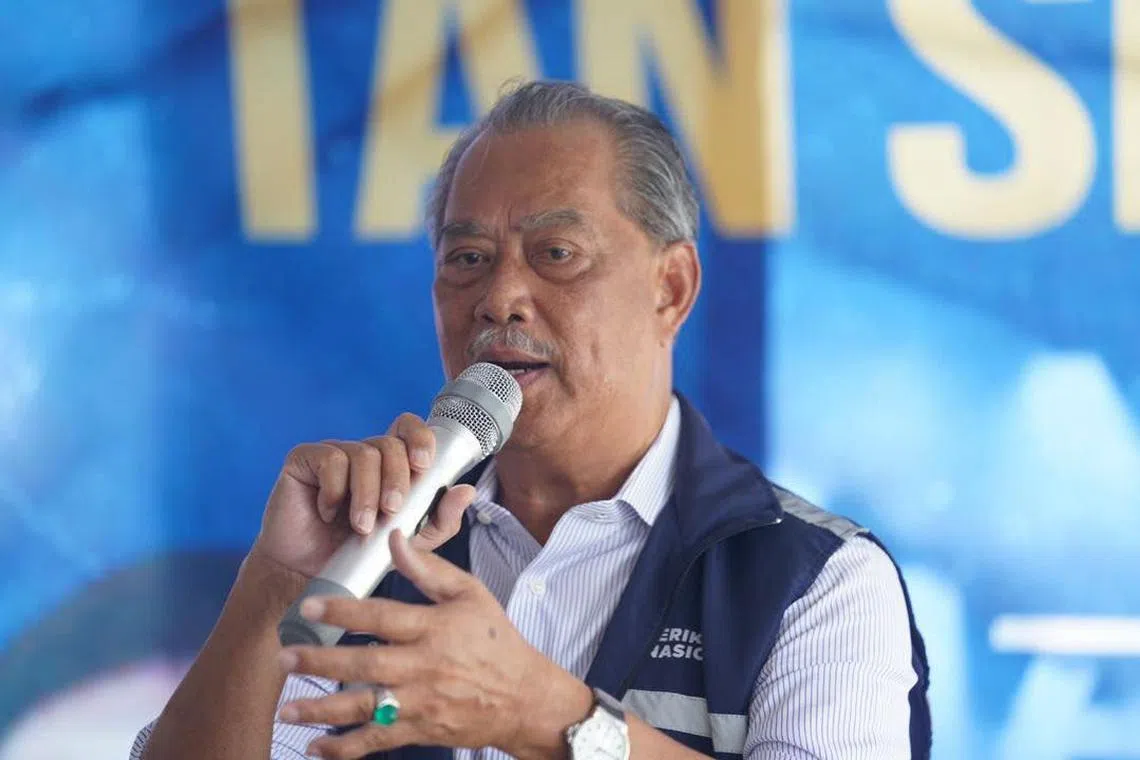 The close associate of former Malaysian prime minister Muhyiddin Yassin (above) is accused of taking bribes.