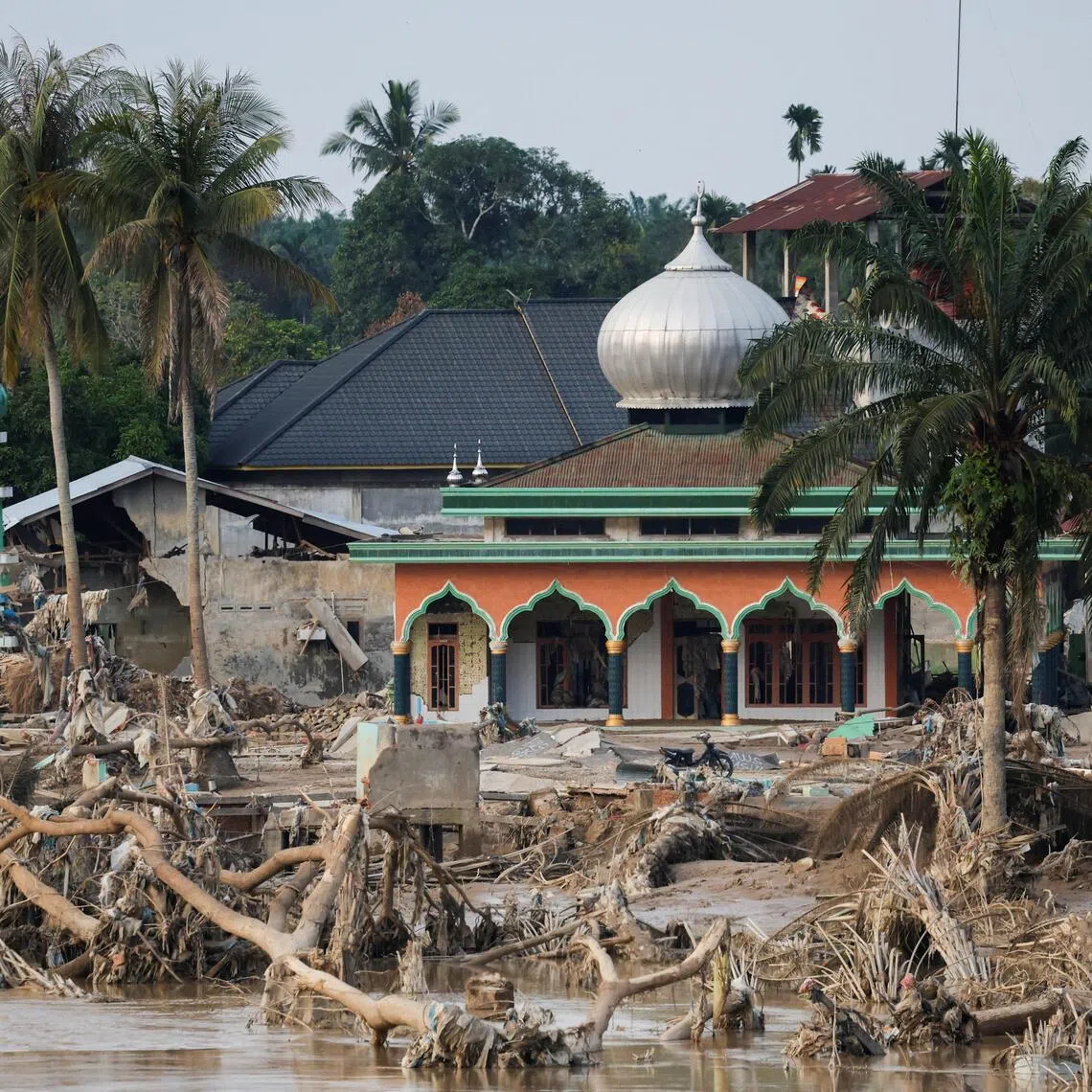 A mosque stands in an area affected by a deadly flash flood following heavy rains in Aceh Tamiang.