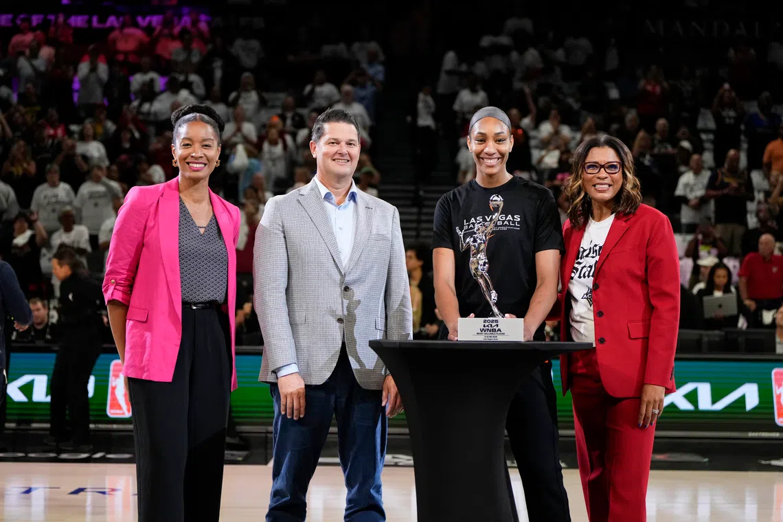 Sep 21, 2025; Las Vegas, Nevada, USA; Las Vegas Aces center A'ja Wilson (22) receives the 2025 WNBA Most Valuable Player award prior to game one of the second round for the 2025 WNBA Playoffs at Michelob Ultra Arena. Mandatory Credit: Lucas Peltier-Imagn Images