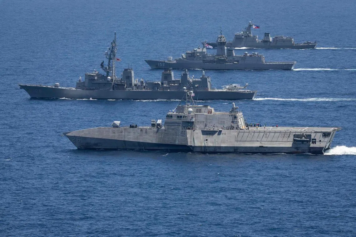 Australian, US and Philippine warships sail in formation during a naval exercise off the Philippine coast.