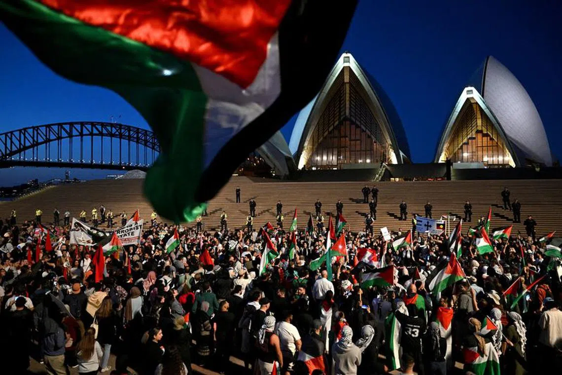 FILE PHOTO: Participants of a pro-Palestinian rally react outside the Sydney Opera House in Sydney, October 9, 2023. AAP Image/Dean Lewins via REUTERS/File Photo