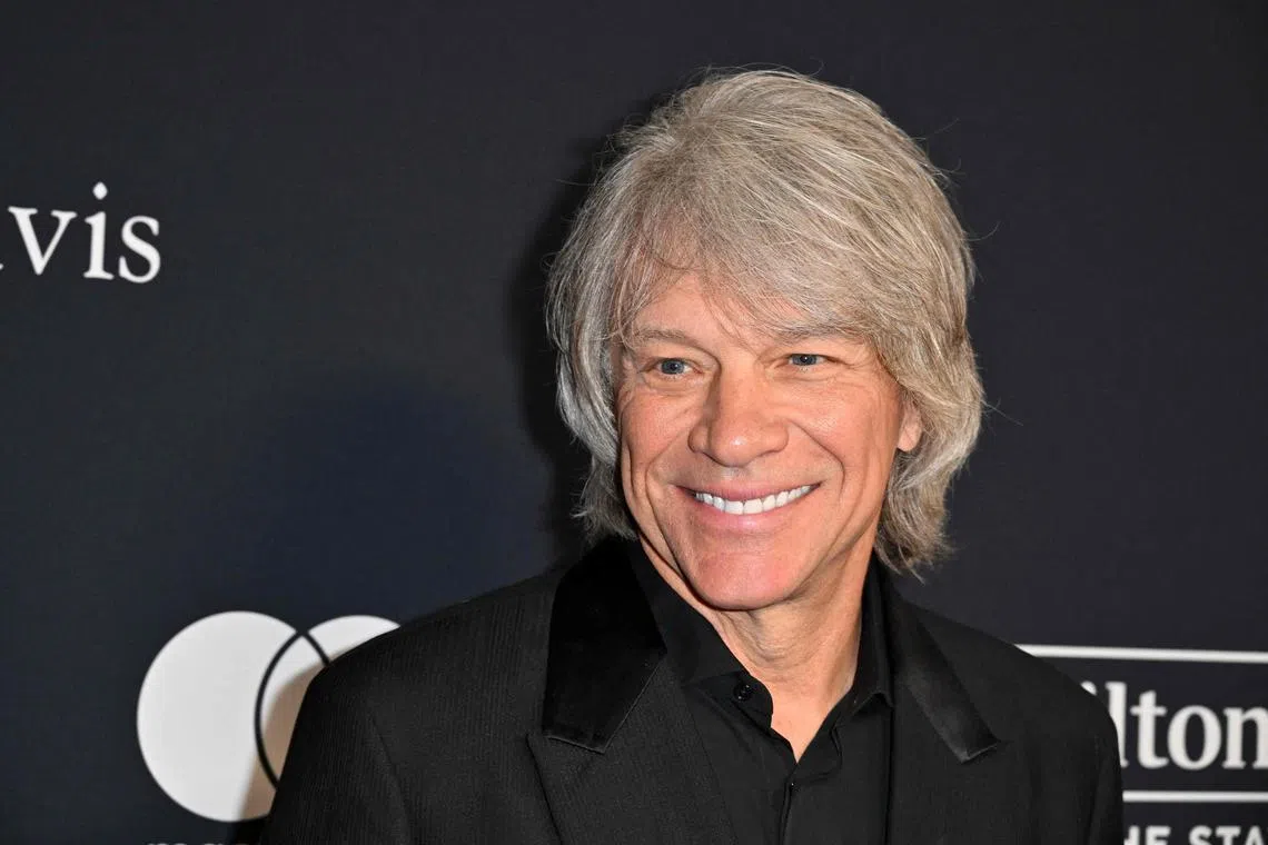 (FILES) US singer-songwriter Jon Bon Jovi arrives for the Recording Academy and Clive Davis' Salute To Industry Icons pre-Grammy gala at the Beverly Hilton hotel in Beverly Hills, California on February 3, 2024. Bon Jovi was celebrated this week, not for a new song, but for helping a woman in need, according to police. The Grammy-winning rocker was shooting a video on September 10, 2024, on the John Seigenthaler Pedestrian Bridge in Nashville, Tennessee, when he and another person saw a woman standing outside the guard railing of the bridge and helped her to safety, US entertainment outlet Deadline reported. (Photo by Robyn BECK / AFP)
