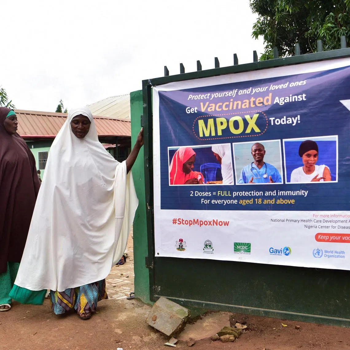 FILE PHOTO: People depart a Primary Health Care Center after receiving mpox vaccination, following the resurgence of mpox cases in Igabi, Kaduna, Nigeria, August 18, 2025. REUTERS/Nuhu Gwamna/ File Photo