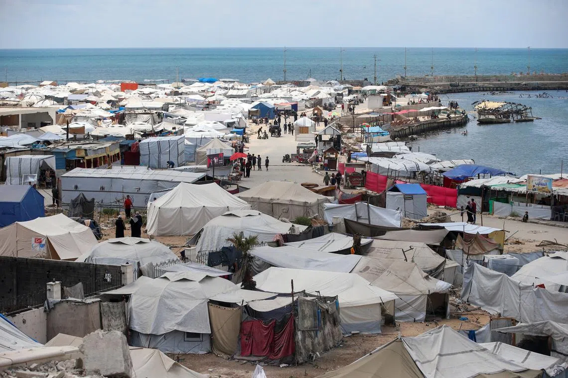 Palestinians displaced by the Israeli military offensive shelter in tents near Gaza's seaport, in Gaza City, May 22, 2025. REUTERS/Mahmoud Issa