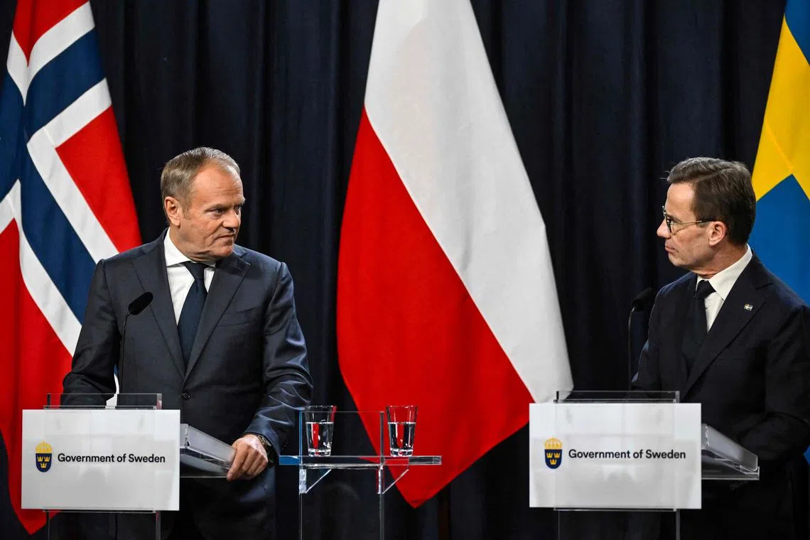 Polish Prime Minister Donald Tusk (left) and Swedish Prime Minister Ulf Kristersson addressing a press conference at the Nordic-Baltic Summit in Sweden, on Nov 27.