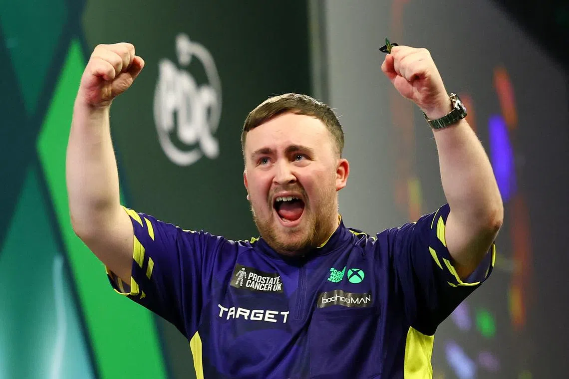 FILE PHOTO: Darts - 2025 PDC World Darts Championship - Alexandra Palace, London, Britain - January 3, 2025 Luke Littler celebrates after winning the 2025 PDC World Darts Championship final against Michael van Gerwen Action Images via Reuters/Andrew Boyers/File Photo