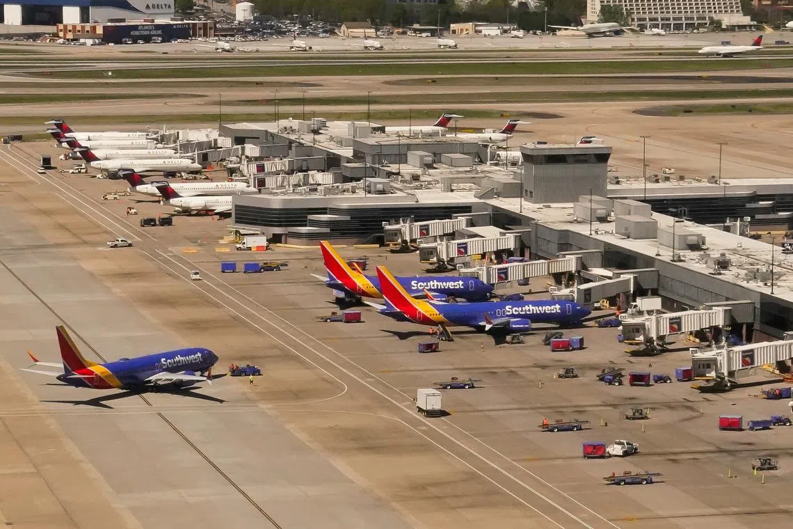 Delta and Southwest commercial airliners are seen at Hartsfield-Jackson Atlanta International Airport in Atlanta, Georgia, U.S., April 5, 2024. REUTERS/Elizabeth Frantz/File Photo