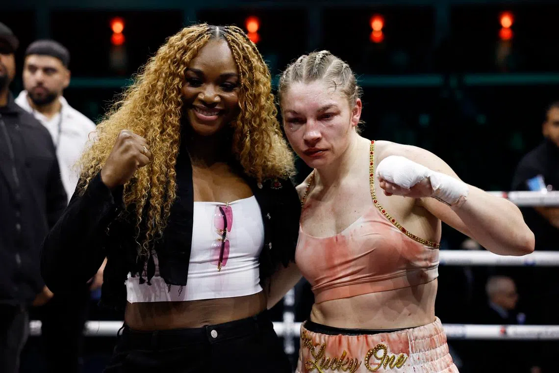 Boxing - Lauren Price v Stephanie Pineiro Aquino - WBA, WBC, IBF & IBO World Welterweight Titles - Cardiff International Arena, Cardiff, Wales - April 4, 2026 Lauren Price poses with Claressa Shields after winning her fight against Stephanie Pineiro Aquino Action Images via Reuters/Andrew Couldridge