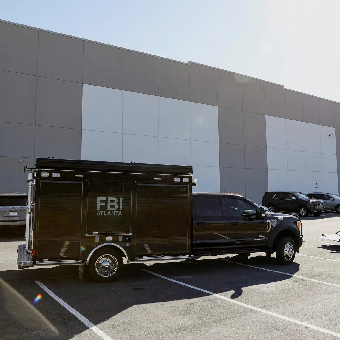 A vehicle of the Federal Bureau of Investigation (FBI) is parked outside the Fulton County Election Hub and Operation Center after the FBI executed a search warrant there in relation to the 2020 election, according to a law enforcement official familiar with the matter, in Union City, Georgia, U.S. January 28, 2026.  REUTERS/Alyssa Pointer