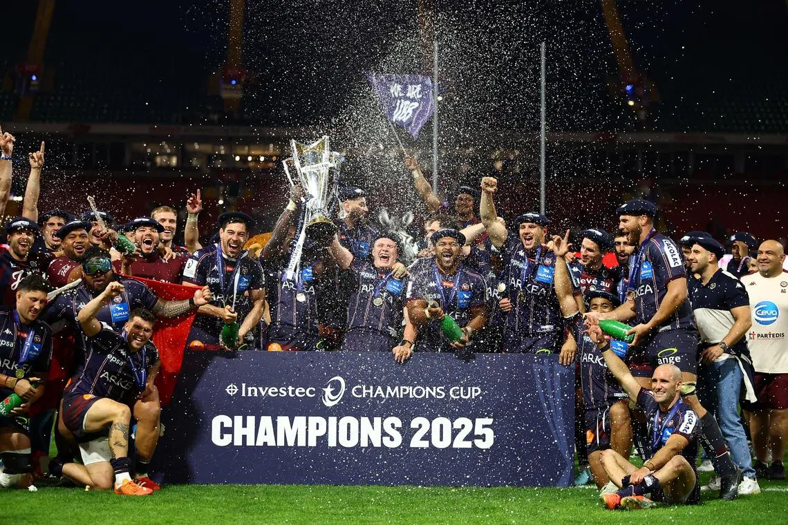 Rugby Union - European Challenge Cup Final - Northampton Saints v Bordeaux Begles - Principality Stadium, Cardiff, Wales, Britain - May 24, 2025  Bordeaux Begles players celebrate with the trophy after winning the European Challenge Cup Action Images via Reuters/Andrew Boyers