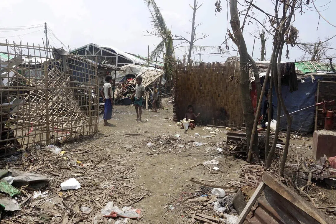 epa10640850 Rohingya children play near damaged houses and debris after cyclone Mocha hit ThetKel Pyin Muslim internally displaced people (IDPs) camp near Sittwe, Rakhine State, Myanmar, 20 May 2023. According to Junta's statement, 145 people, including four soldiers, 24 locals and 117 Rohingya people were killed as cyclone Mocha on 14 May hit the coastal regions of Myanmar with maximum sustained winds of 250 kph, wreaking havoc on thousands of vulnerable communities. According to the Global Disaster Alert and Coordination System (GDACS), around three million people in Myanmar and Bangladesh were affected by the strong winds.  EPA-EFE/STRINGER