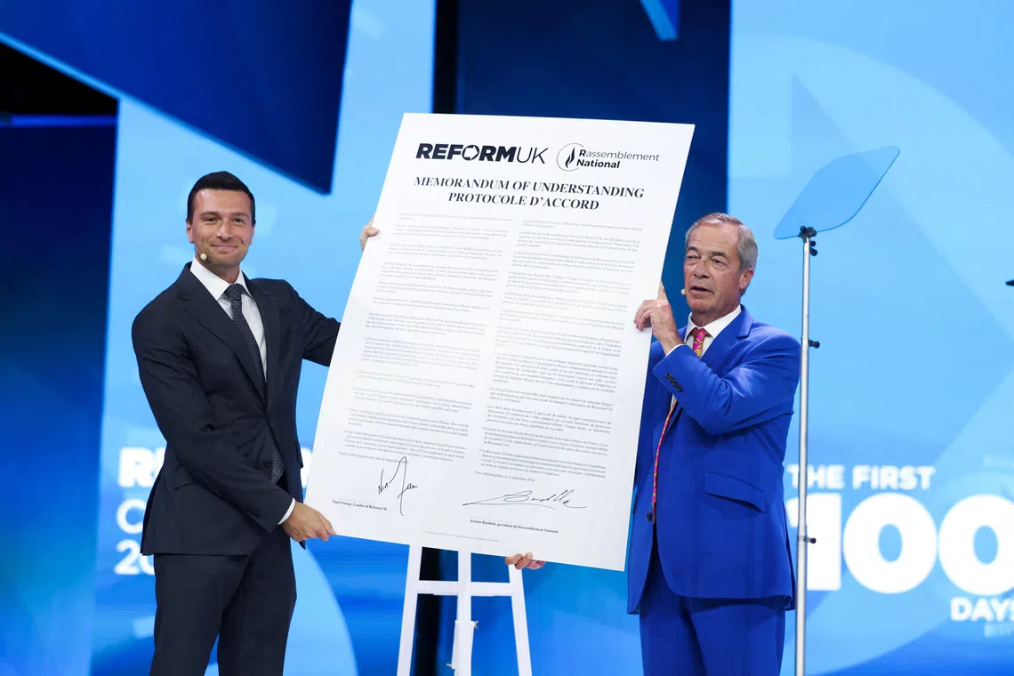 Britain's Reform UK party leader and MP for Clacton, Nigel Farage, and President of the French far-right party Rassemblement National (RN), Jordan Bardella, react after signing a Memorandum of Understanding between the two parties during the Reform UK party conference in Birmingham, Britain, September 4, 2026. REUTERS/Temilade Adelaja