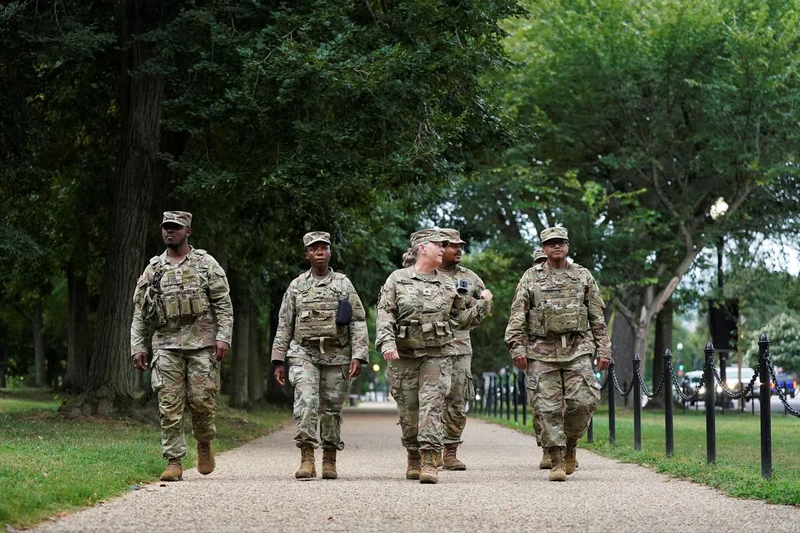 Members of the National Guard patrol after U.S. President Donald Trump deployed the force and ordered an increased presence of federal law enforcement to assist in crime prevention, in Washington, D.C., U.S., August 18, 2025. REUTERS/Ken Cedeno