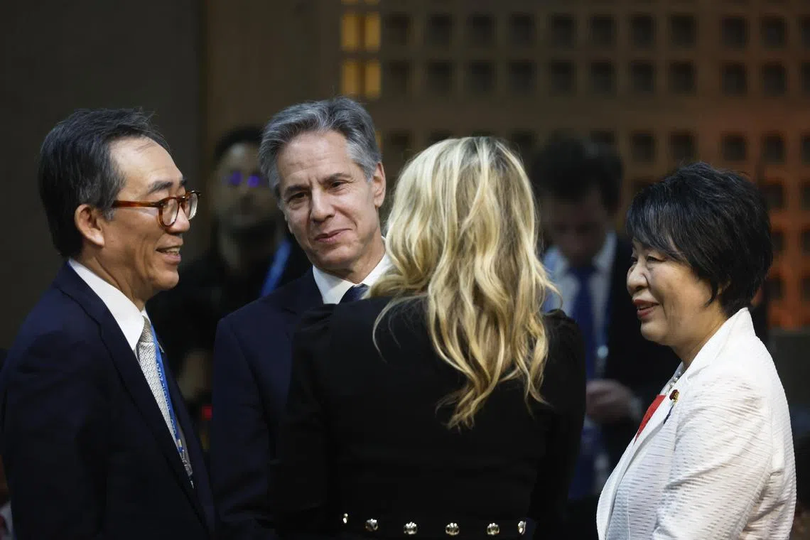 South Korea's foreign minister Cho Tae-yul and Japanese counterpart, Yoko Kamikawa (right) talk at the opening of the G-20 foreign ministers' meeting in Rio de Janeiro, Brazil, on Feb 21, 2024. They are joined by United States Secretary of State, Antony Blinken and Canada foreign minister Melanie Joly.