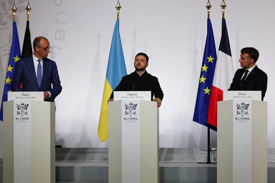 Germany's Chancellor Friedrich Merz, Ukraine's President Volodymyr Zelenskiy and France's President Emmanuel Macron deliver a press conference upon the signing of the declaration on deploying post-ceasefire force in Ukraine during the so-called 'Coalition of the Willing' summit, at the Elysee Palace in Paris, France, January 6, 2026. Ludovic Marin/Pool via REUTERS