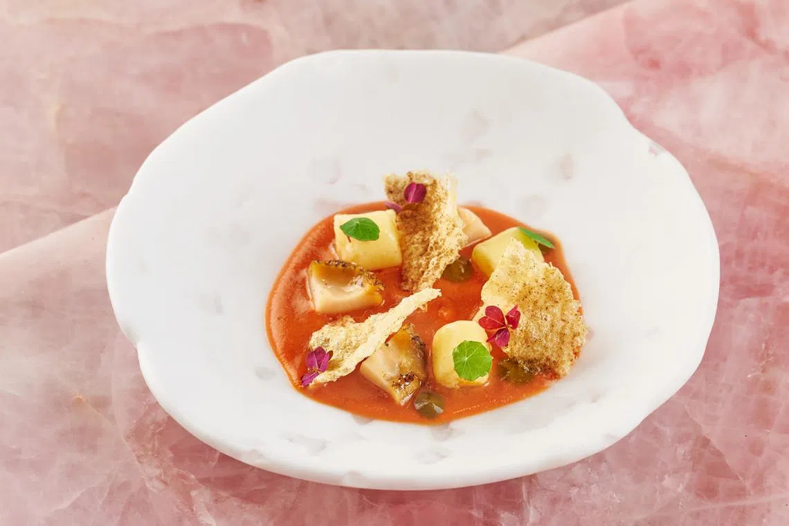 Curanto - abalone wrapped in corn husks, covered in charcoal and corn husk ash and cooked over fire, at Araya. 