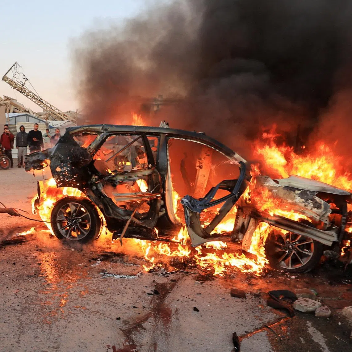 A vehicle burns following an Israeli strike that killed Al Jazeera journalist Mohammad Weshah, according to medics, in Gaza City April 8, 2026.  REUTERS/Dawoud Abu Alkas