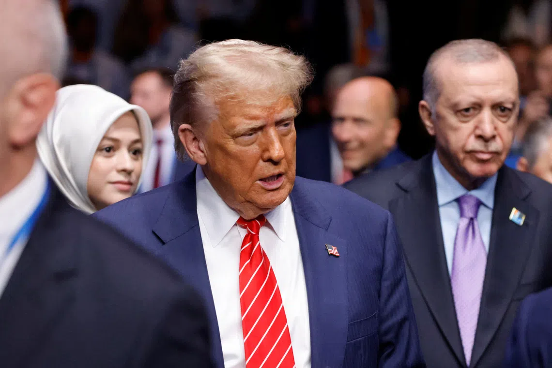 US President Donald Trump and Turkey's President Recep Tayyip Erdogan arrive to attend the North Atlantic Council plenary meeting at the North Atlantic Treaty Organisation (NATO) summit in The Hague on June 25, 2025.   LUDOVIC MARIN/Pool via REUTERS/File Photo