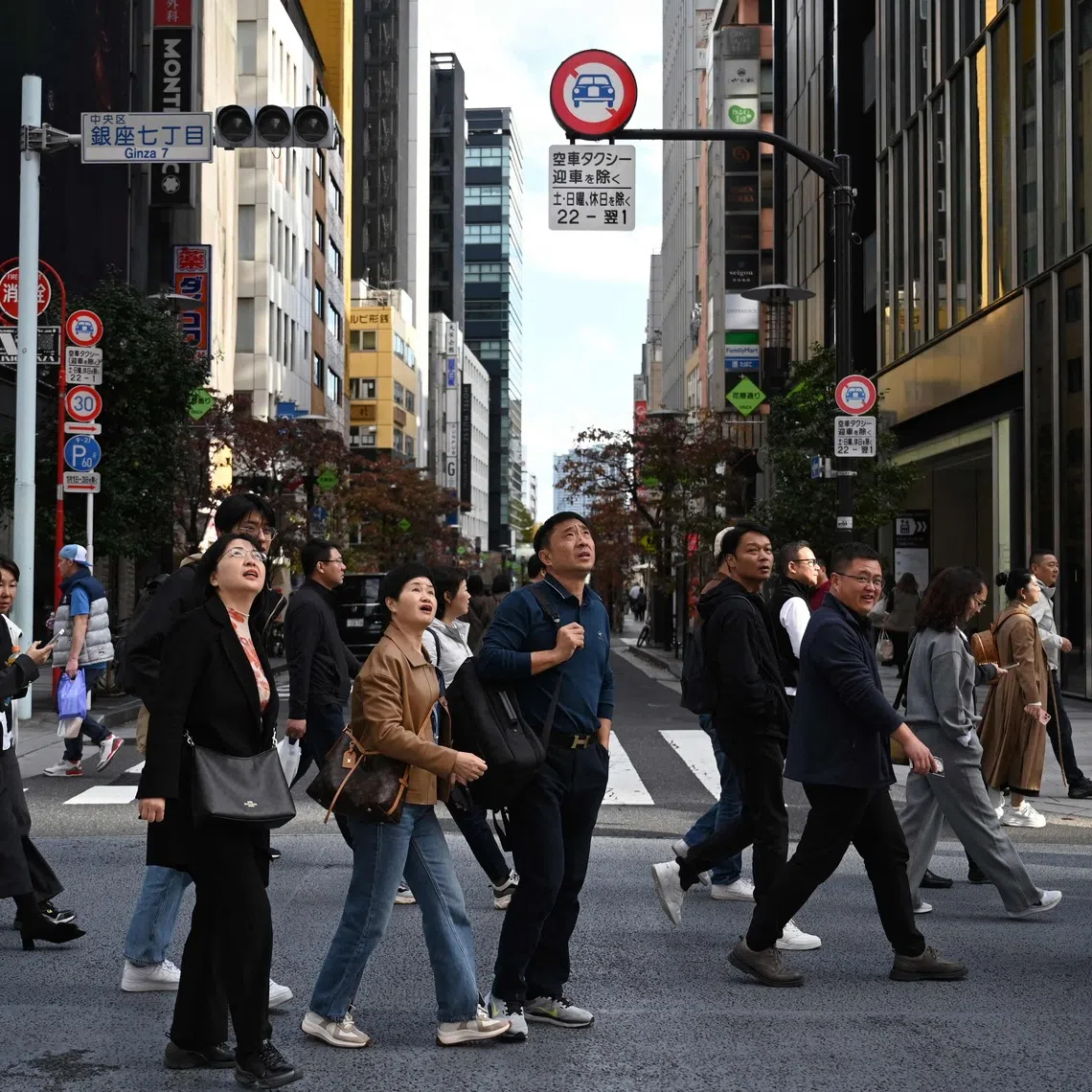 A Chinese tour group at Tokyo's Ginza shopping district on Nov 16.