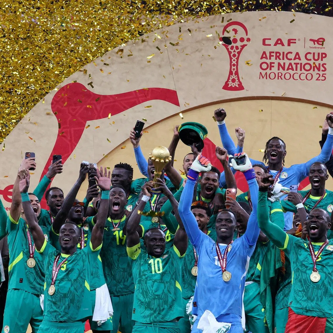 FILE PHOTO: Soccer Football - CAF Africa Cup of Nations - Morocco 2025 - Final - Senegal v Morocco - Prince Moulay Abdellah Stadium, Rabat, Morocco - January 18, 2026 Senegal's Sadio Mane lifts the trophy with teammates as they celebrate after winning the Africa Cup of Nations. REUTERS/Amr Abdallah Dalsh/File Photo