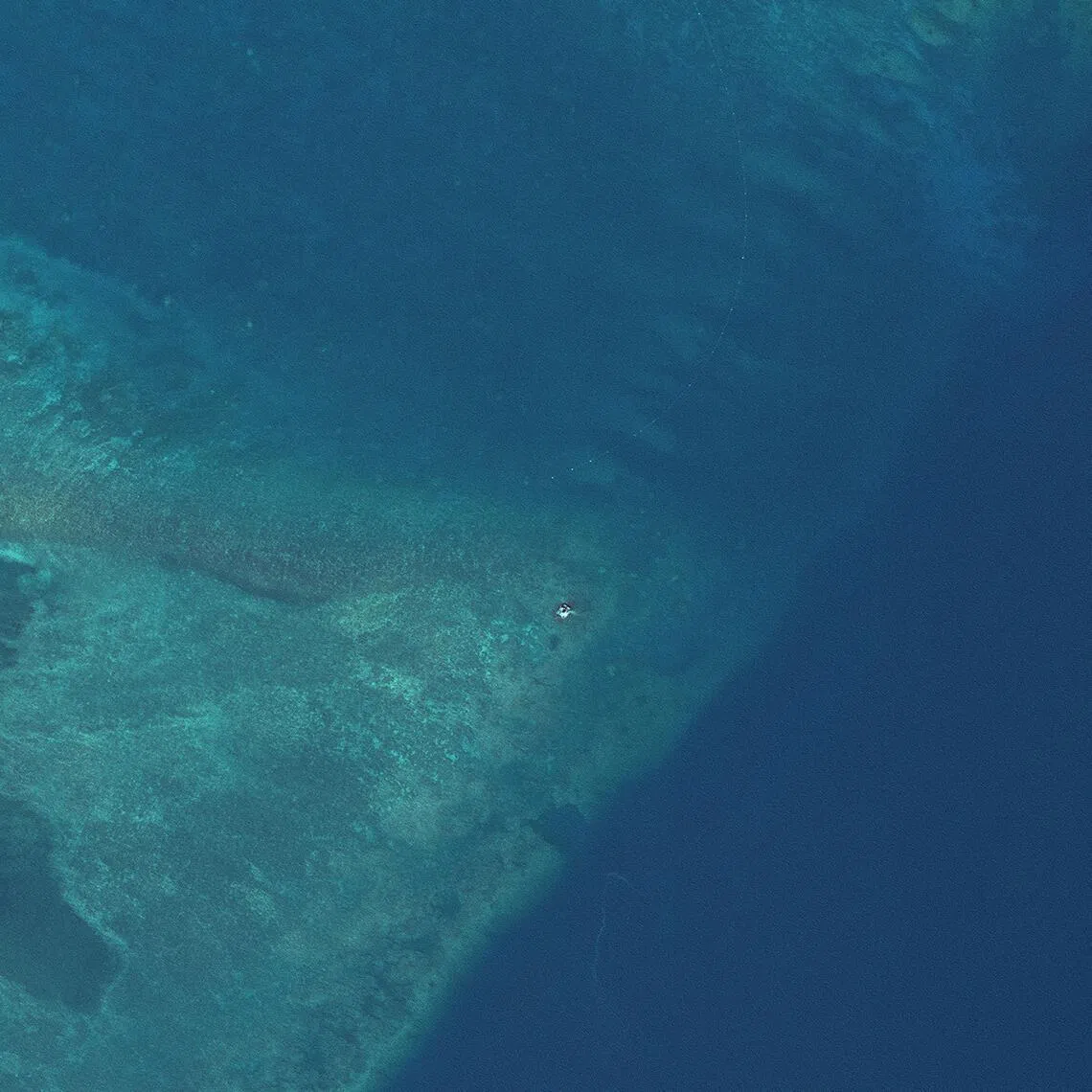 A satellite image shows a possible raft at the opening to Scarborough Shoal, in the South China Sea, on May 27.