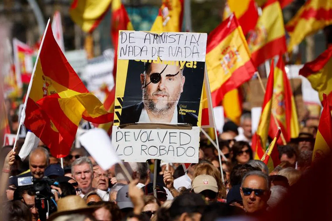 File photo: A picture of ERC's leader Oriol Junqueras is shown during a unionist protest against amnesty of separatist leaders and activists involved in the 2017 failed independence drive at Passeig de Gracia in Barcelona, Spain, October 8, 2023. REUTERS/ Albert Gea/File photo
