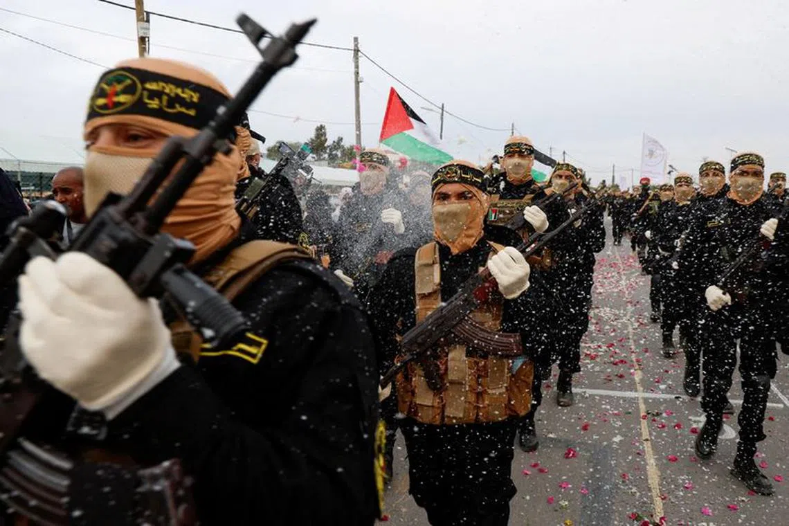 FILE PHOTO: Palestinian Islamic Jihad militants participate in an anti-Israel military parade marking the 36th anniversary of the movement's foundation in Gaza City, October 4, 2023. REUTERS/Mohammed Salem/File Photo