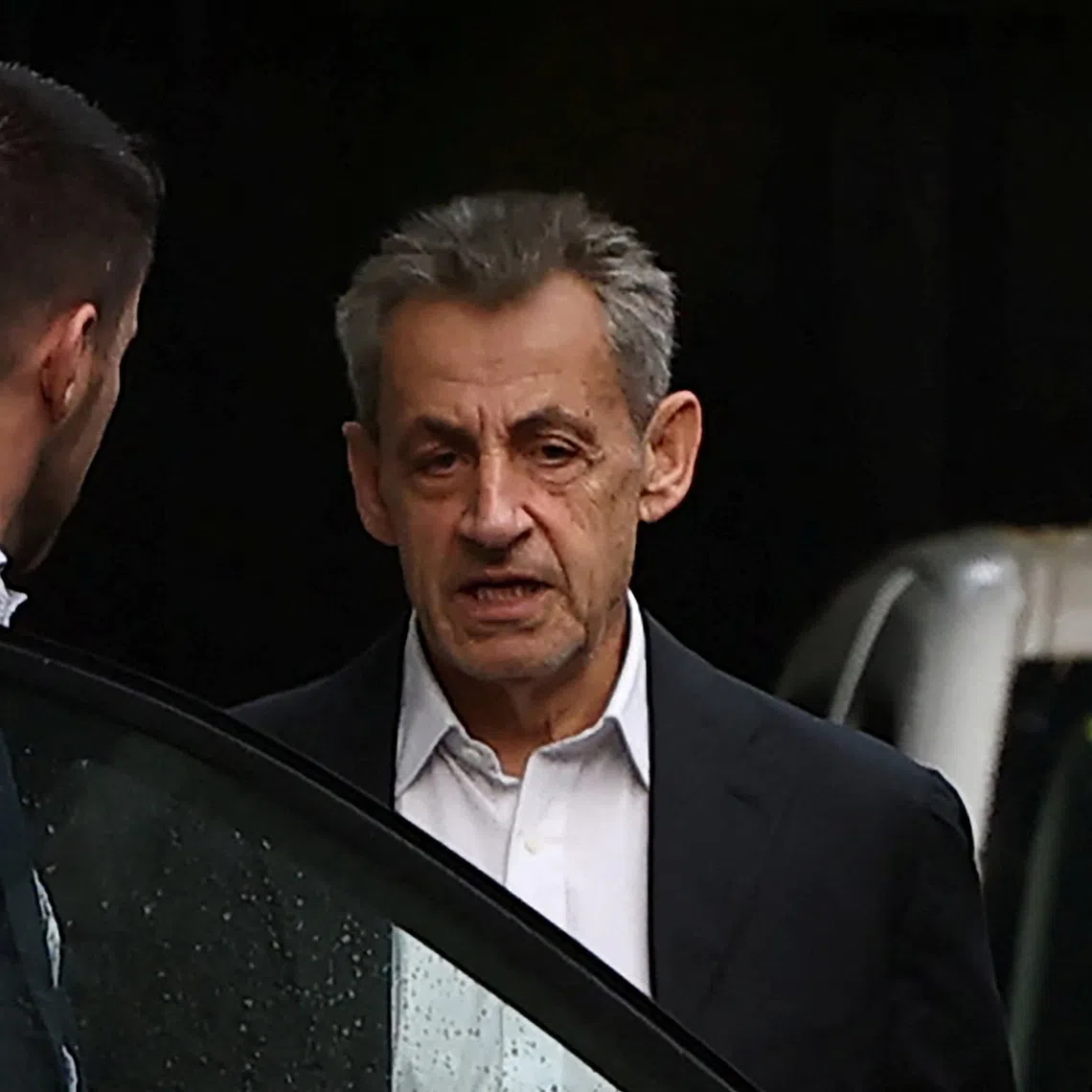 Former French President Nicolas Sarkozy is seen next to his house after a visit of a guest on the eve of the start of his five-year prison sentence for criminal conspiracy over attempts to raise campaign funds from Libya, in Paris, France, October 20, 2025. REUTERS/Gonzalo Fuentes