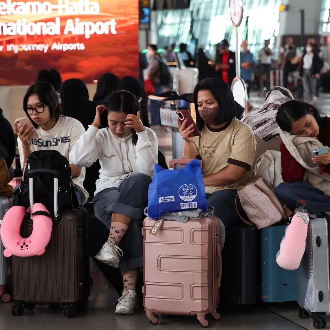 Stranded passengers waiting at a terminal as Soekarno Hatta International Airport closed its operations on Sept 7 due to the eruption of the Anak Krakatau volcano.