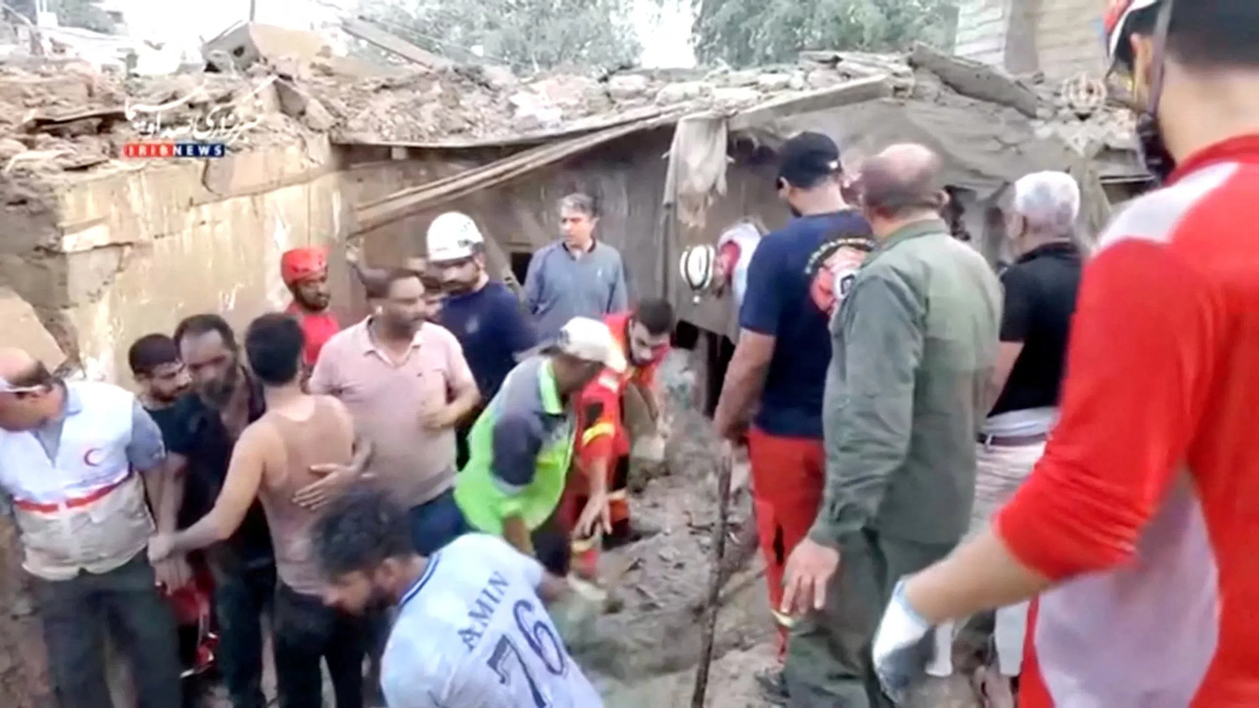 A still image from video shows rescuers clearing rubble to search for victims, following a strike in Qeshm, Iran.