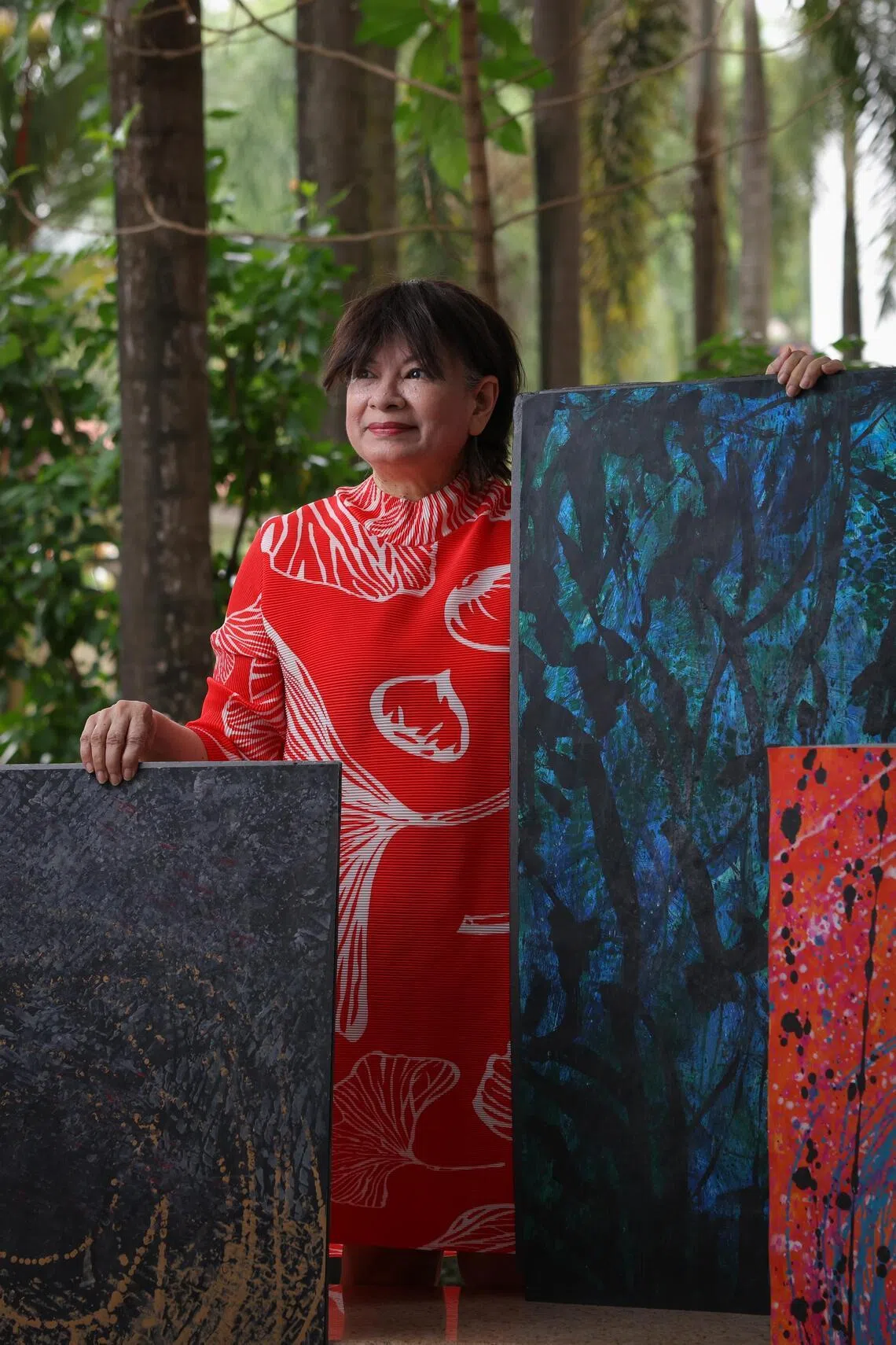 Karen Hoisington with some of her acrylic on canvas works.