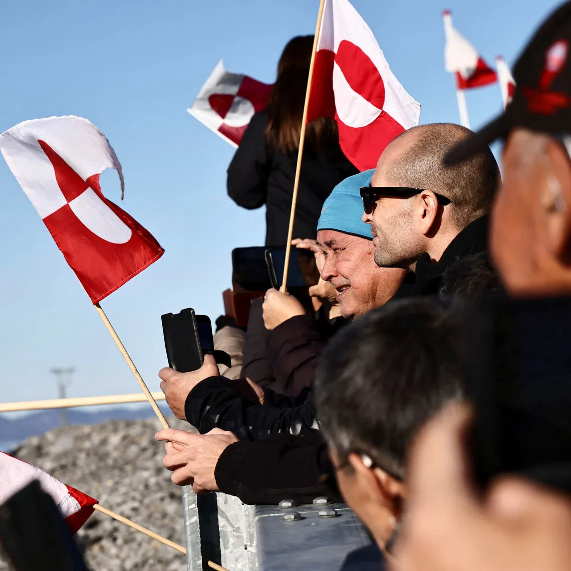People wait for the arrival of the Greenlandic delegation after they agreed on a security deal with the US and Denmark at Nuuk Airport in Nuuk, Greenland, September 23, 2026. REUTERS/Tim Barsoe