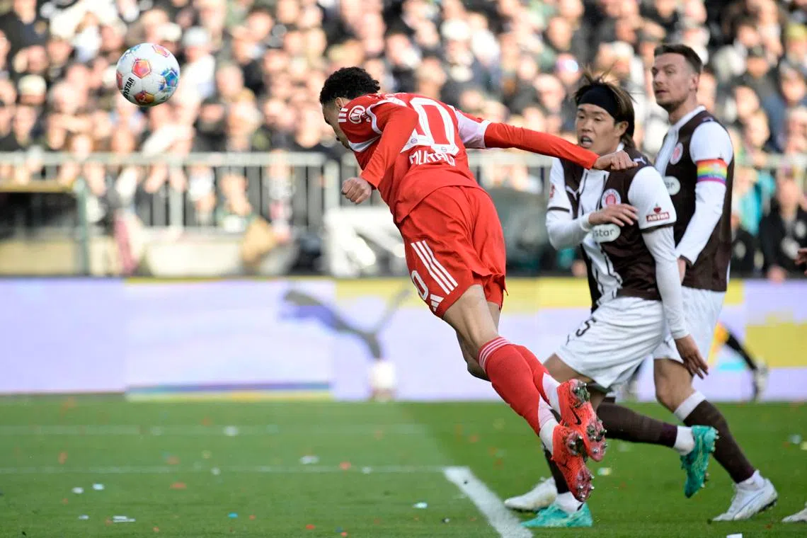 Soccer Football - Bundesliga - St. Pauli v Bayern Munich - Millerntor-Stadion, Hamburg, Germany - April 11, 2026 Bayern Munich's Jamal Musiala scores their first goal REUTERS/Fabian Bimmer