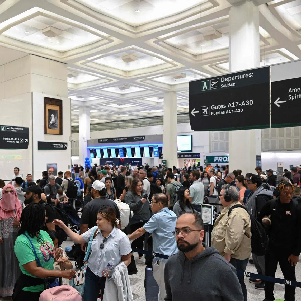 Travellers waiting in long lines at George Bush Intercontinental Airport in Houston, Texas on March 27, 2026. 
