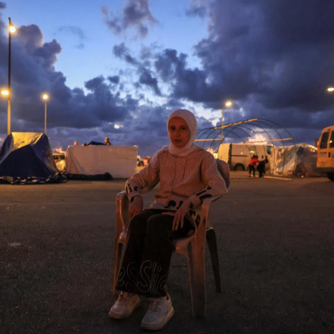 Nariman Al-Issa, 12, a Syrian orphan girl who lost four members of her family during an Israeli strike on Beirut southern suburbs, poses for a photo during an interview with Reuters, at a temporary encampment for displaced people, amid escalating hostilities between Israel and Hezbollah, as the U.S.-Israel conflict with Iran continues, in Beirut, Lebanon, March 30, 2026. REUTERS/Raghed Waked