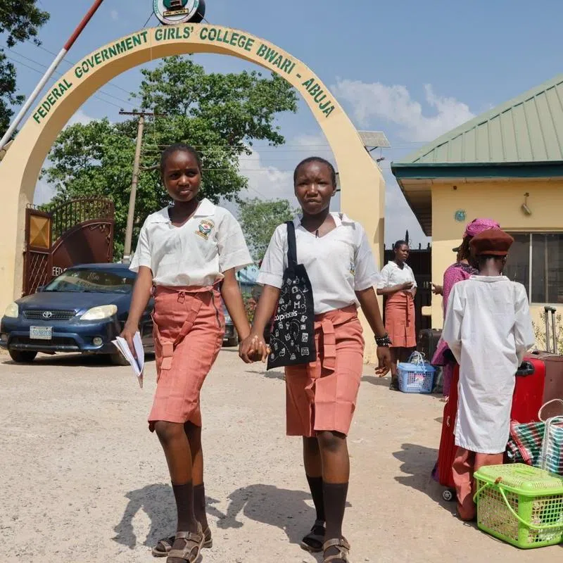 Parents picking up their children from a college in Abuja, Nigeria, on Nov 22, amid a spate of mass kidnappings in the country.