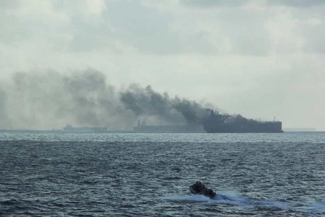 FILE PHOTO: A handout image shows the RSS Supreme's rigid-hulled inflatable boat in the vicinity of the burning vessels following a fire on two oil tankers about 55 km (34 miles) northeast of the Singaporean island of Pedra Branca, July 19, 2024. Republic of Singapore Navy/Handout via REUTERS/File Photo